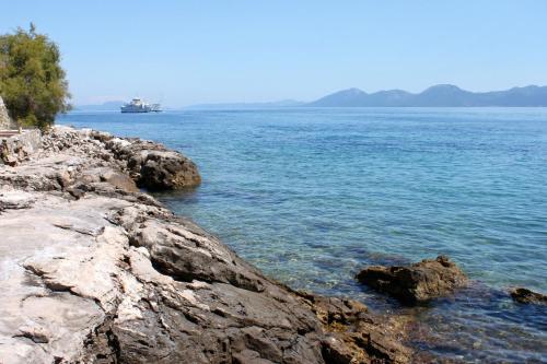 a large body of water with a ship in the distance at Rooms by the sea Sucuraj, Hvar - 6734 in Sućuraj