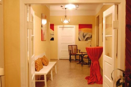 a hallway with a living room with a table at Gut Zentgraf in Mörbisch am See
