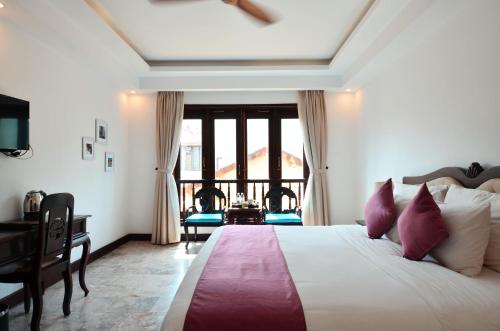 Katil atau katil-katil dalam bilik di Hoian Central Hotel