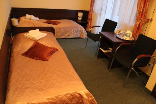 Postel nebo postele na pokoji v ubytování Farys - świetna lokalizacja, sauna, jacuzzi, piękne widoki z okien