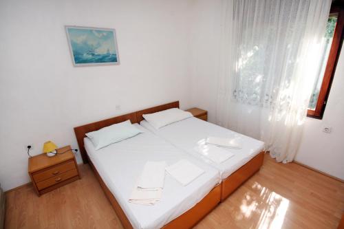 Postel nebo postele na pokoji v ubytování Apartment Suha Punta 5050a
