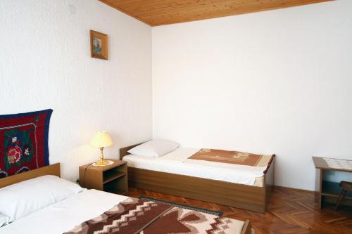 Ένα ή περισσότερα κρεβάτια σε δωμάτιο στο Apartment Poljanak 5195a