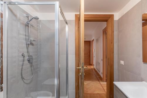 a bathroom with a shower with a glass door at iFlat Synagogue at Your Feet in Rome