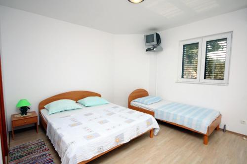 En eller flere senge i et værelse på Studio Balica Rat 4868h