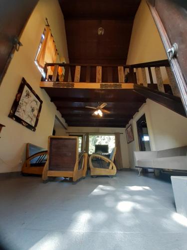 a room with two bunk beds and a staircase at Puri Kutat Lestari in Sanur