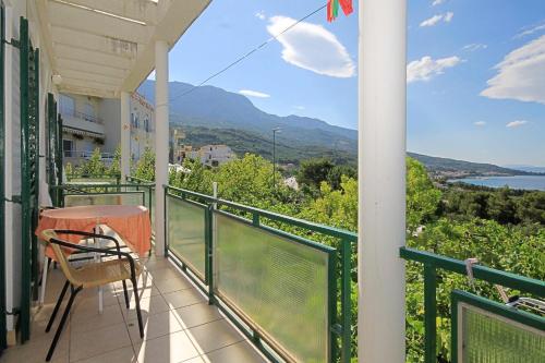 a balcony with a table and a view of the water at Studio Tucepi 6901a in Tučepi