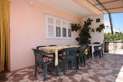 a dining room with a table and chairs at Double Room Sucuraj 6734b in Sućuraj