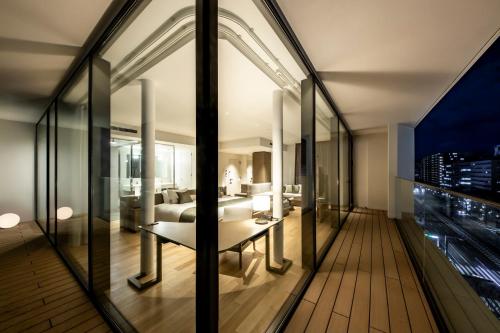 a room with a view of a city at The Royal Park Hotel Iconic Kyoto in Kyoto