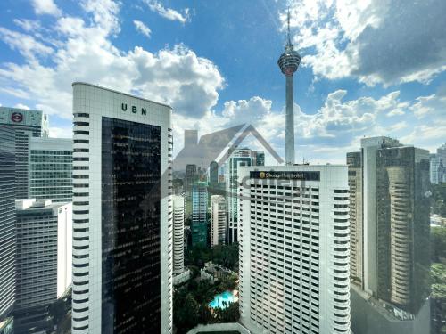 a view of a city skyline with the cn tower at Vortex Premium Suites KLCC by SCHIEN in Kuala Lumpur