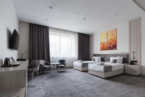 Телевизор и/или развлекательный центр в Hotel Inspira-S Tashkent