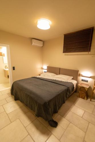 a bedroom with a large bed in a room at Harmony Seaview Villas In Elafonisos in Elafonisos