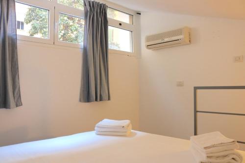 Posteľ alebo postele v izbe v ubytovaní Cozy & large Loft FAMAGOSTA