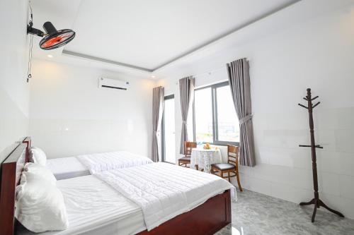 Voodi või voodid majutusasutuse Ruby Hotel - Tân Uyên - Bình Dương toas