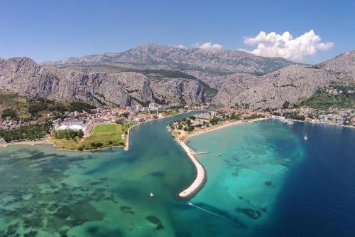 an aerial view of a beach in the water at Apartments with WiFi Omis - 9460 in Omiš