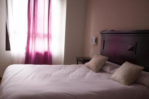 Cama o camas de una habitación en Hotel Rural Camero Viejo