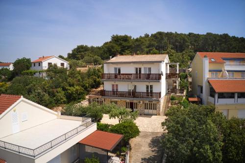 arial view of a house in a city at Apartments and rooms by the sea Tisno, Murter - 5128 in Tisno