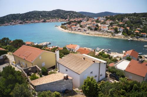 an aerial view of a town and a body of water at Apartments and rooms by the sea Tisno, Murter - 5128 in Tisno