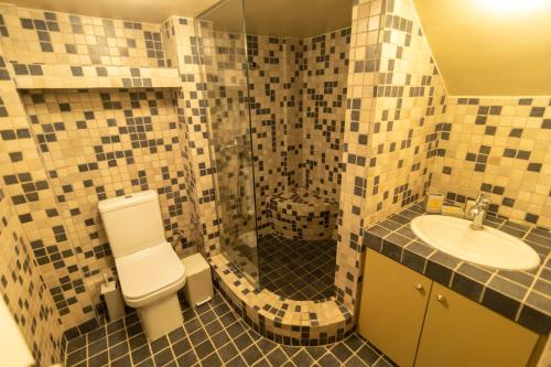 a bathroom with a toilet and a sink at Harmony Seaview Villas In Elafonisos in Elafonisos