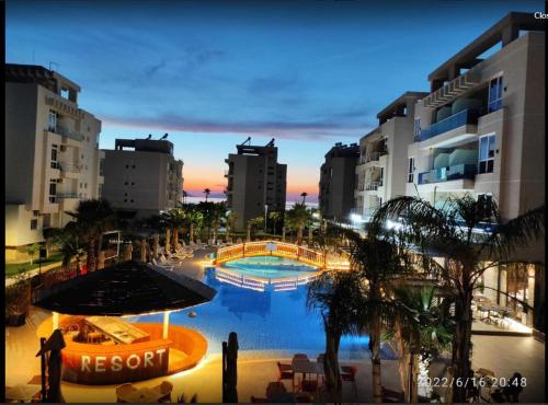 a view of a resort with a pool and buildings at Radhima Beach Apartment-Tirana Resort in Orikum