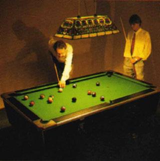 a man standing next to a pool table at Hotel Adler in Lichtenstein/ Baden Wurttemberg
