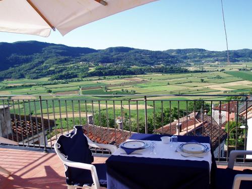 a table and chairs on a balcony with a view at La Quiete Bed & Breakfast in Brendola