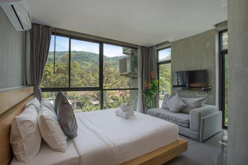 En eller flere senge i et værelse på Villa Jeanne