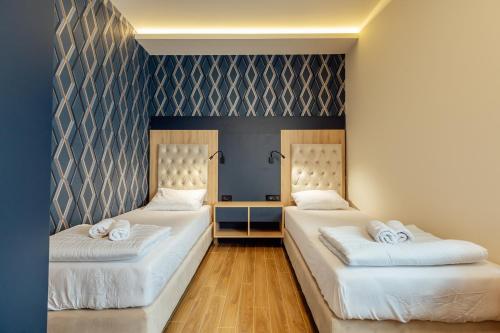 Ein Bett oder Betten in einem Zimmer der Unterkunft Apartments Belani Zelenika