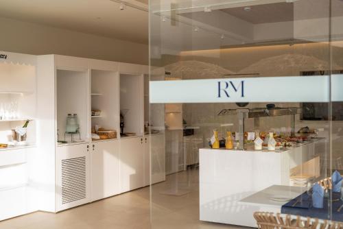 a display case in a room with food on display at Royal Marina Suites Boutique Hotel - Adults Only in Puerto Calero