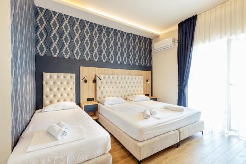 Ein Bett oder Betten in einem Zimmer der Unterkunft Apartments Belani Zelenika