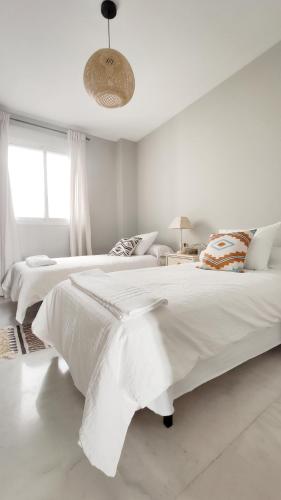 Un ou plusieurs lits dans un hébergement de l'établissement Mágnífico apartamento en el centro de Sevilla