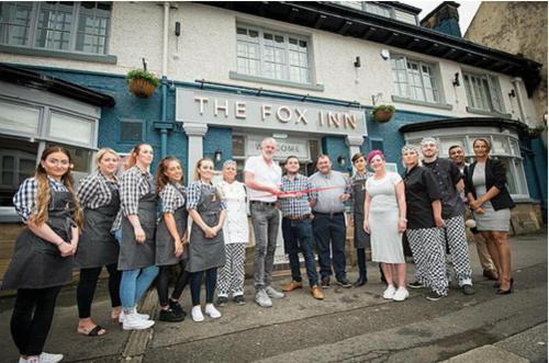 a group of people standing in front of a building at Fox Inn in Guisborough