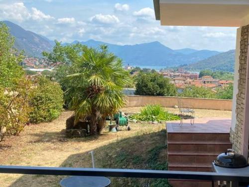 a view of a palm tree from a balcony at B&B La Fenice sul Lago in Villongo SantʼAlessandro