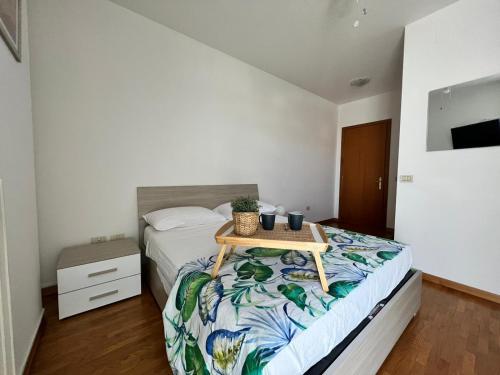 a bedroom with a bed with a table on it at Stella Guest House, Family & Pet Friendly in Perugia