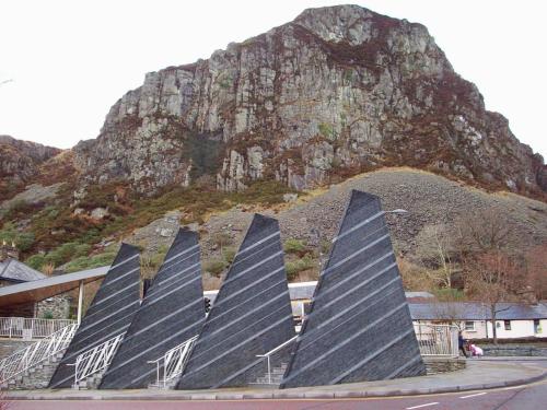 a group of blue and white sails in front of a mountain at Zipworld Waterfalls Eryri Dogs Welcome 3 Bed sleeps 5 in Blaenau-Ffestiniog