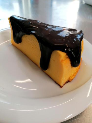 a piece of cheesecake on a white plate at Agriturismo Da Andreina in Borso del Grappa