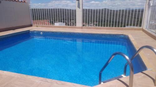 a swimming pool with a view of the ocean at Pousada da Seresta in Diamantina