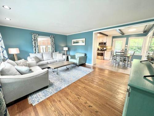 a living room with a couch and a table at The Best Family & Friends Hangout & Pet Friendly!! in Wilmington