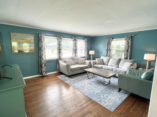 a living room with two couches and a table at The Best Family & Friends Hangout & Pet Friendly!! in Wilmington