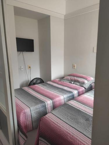 Postelja oz. postelje v sobi nastanitve Apartamento cobertura em Ondina