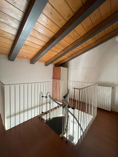 an empty room with a treadmill in a building at Easy Milano - Rooms and Apartments Navigli in Milan
