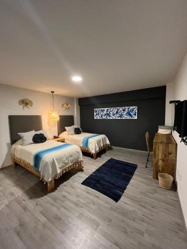 Ένα ή περισσότερα κρεβάτια σε δωμάτιο στο Zen Suites by Regente