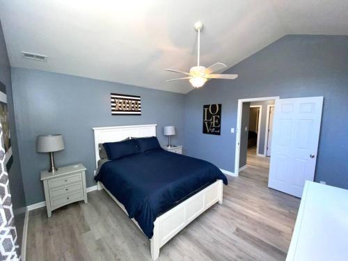 a bedroom with a bed and a ceiling fan at The Best Getaway Friends & Family Hangout!!! in Jacksonville