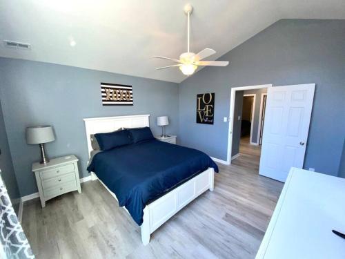 a bedroom with a bed and a ceiling fan at The Best Getaway Friends & Family Hangout!!! in Jacksonville