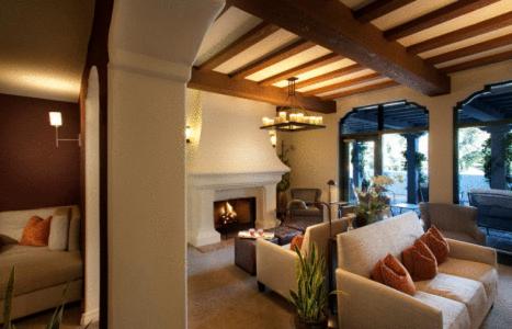 a living room with couches and a fireplace at Ojai Valley Inn in Ojai