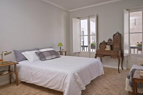 Ένα ή περισσότερα κρεβάτια σε δωμάτιο στο Casas do Arco