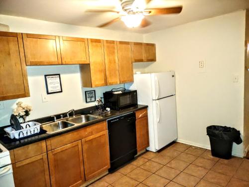 a kitchen with a sink and a refrigerator at Room in Guest room - Cozy Bedroom close to downtown in Baltimore