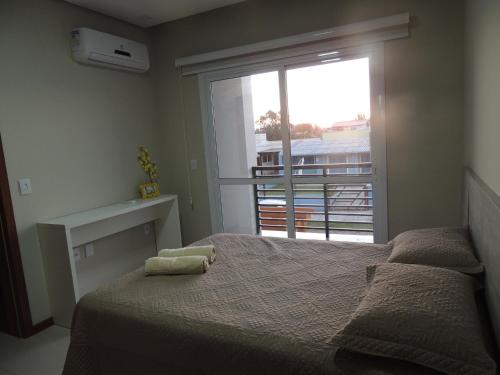 Llit o llits en una habitació de Casa de Praia em Torres RS Praia Lagoa jardim