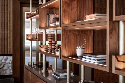 a library with wooden shelves and books at The Dupont Circle Hotel in Washington