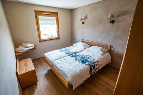 Posteľ alebo postele v izbe v ubytovaní Gîte des Courtans de Jeanne