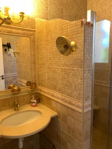 a bathroom with a sink and a mirror at Lachi Marina Villa #17 in Polis Chrysochous